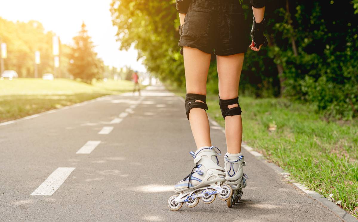 concept of woman in inline skates in park