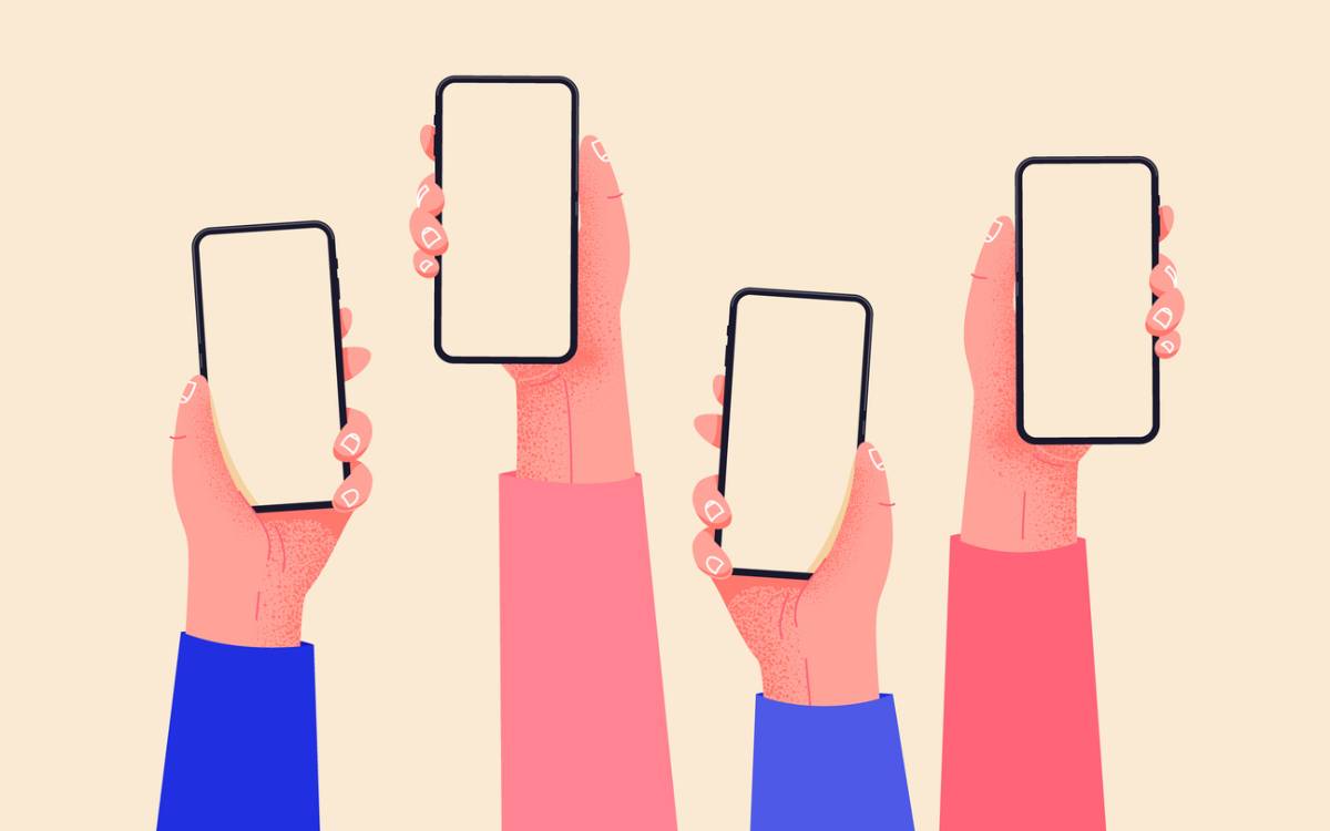 Hands holding phones with empty screens mock up.