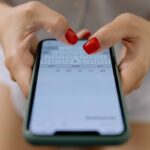 Closeup of woman texting.