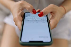 Closeup of woman texting.